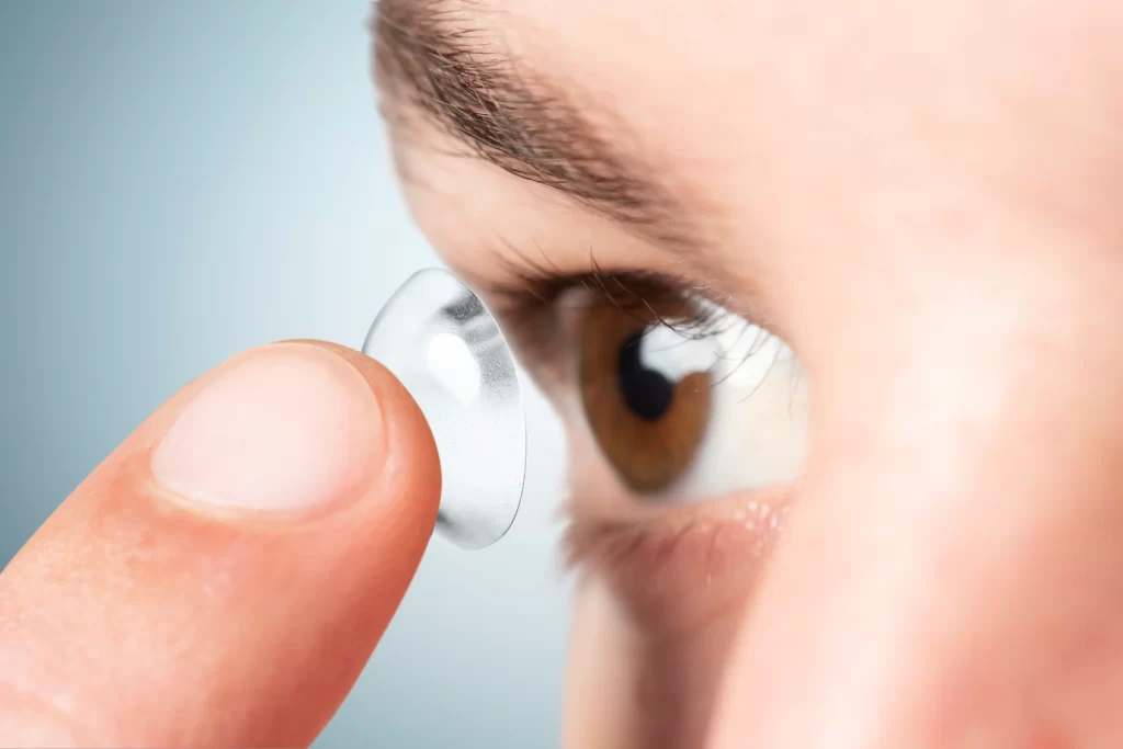 close up of a man putting in a contact lens