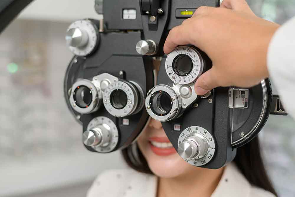 Woman being examined with an eye exam device
